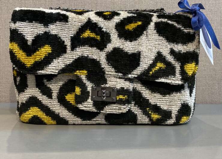 Black, yellow, and cream clasp purse