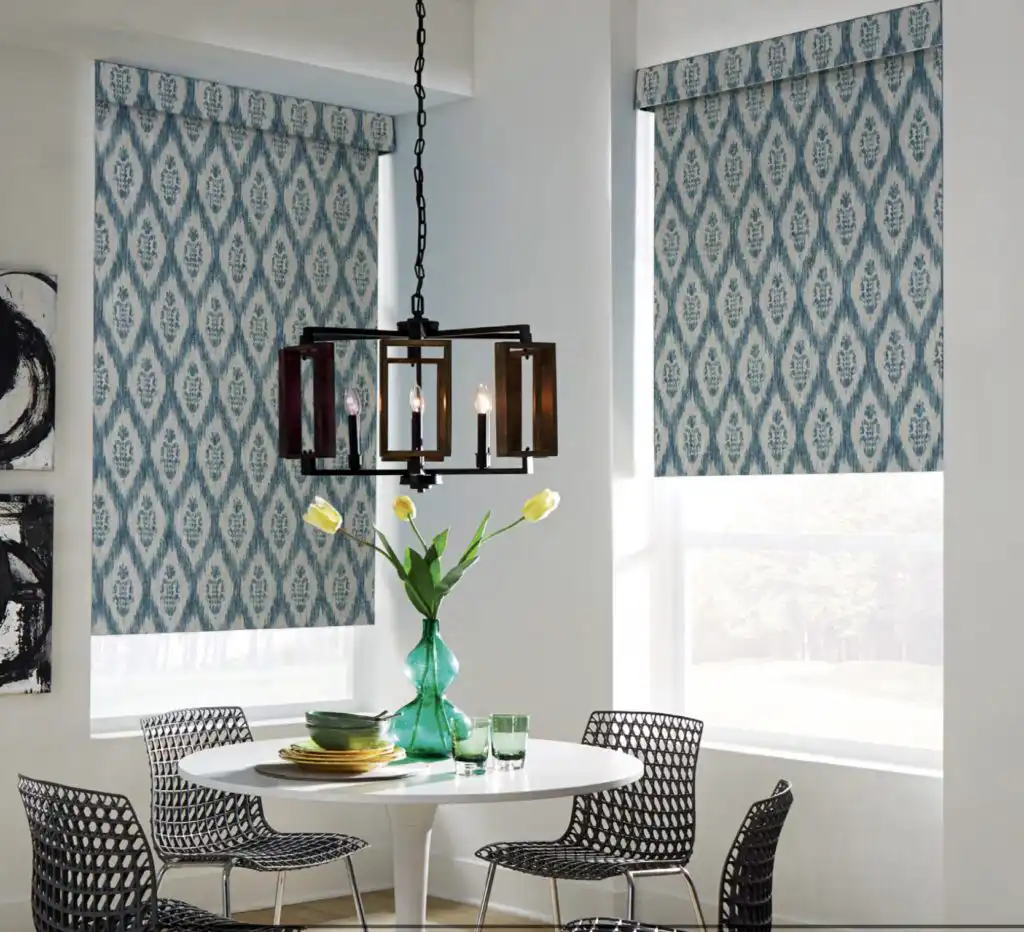 Layered window treatments with woven shades and drapery panels for light control and style